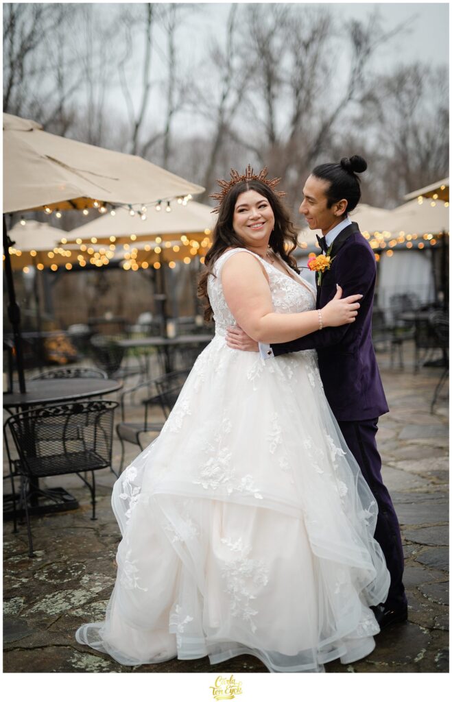 A bride and groom laugh during portraits at their colorful wedding at Lord Thompson Manor in Thompson CT