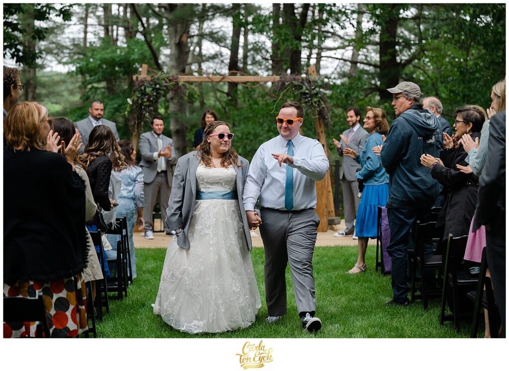 A couple walks down the aisle after being married at their Pinecroft Estate wedding in Thompson CT