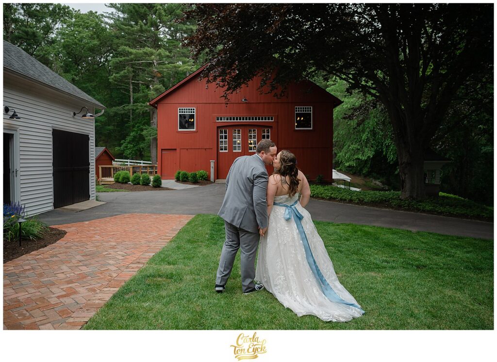 A couple kisses at their Pinecroft Estate wedding in Thompson CT