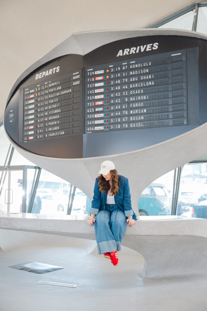 A marketing consultant adds a pop of red in her outfit for her banding session at the TWA Hotel in NYC