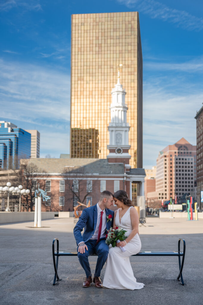 A couple shares a moment during their portraits after their elopement at Hartford City Hall in Hartford CT.