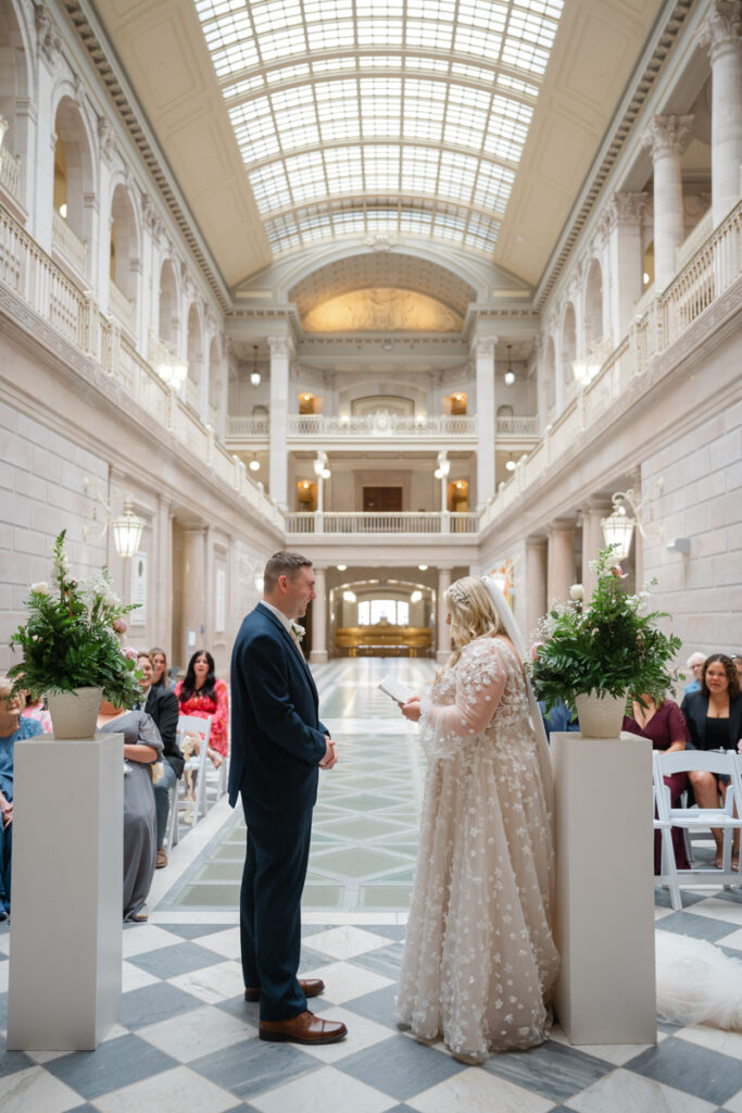 A bride and groom exchange their vows at their elopement ceremony in Hartford City Hall in Hartford CT.