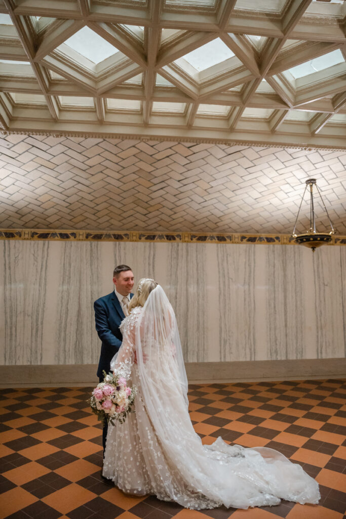 A bride and groom share an intimate moment in the basement of Hartford City Hall after their elopement in Hartford CT