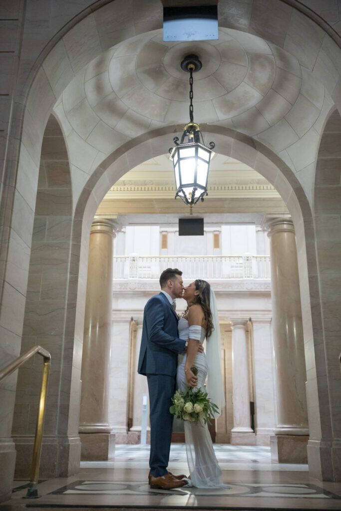 A bride and groom kiss after their Hartford City Hall elopement in Hartford CT.