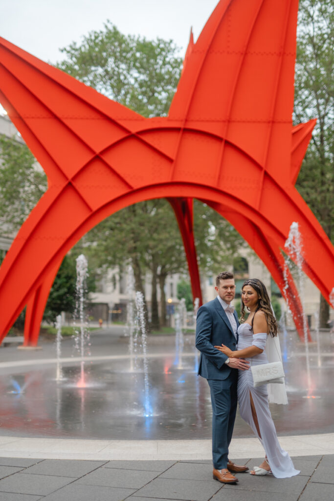 A couple poses for photographs after their elopement at Hartford City Hall in Hartford CT.