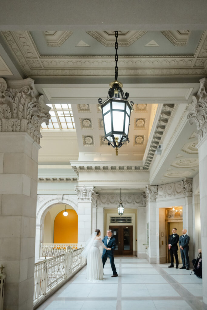 A bride shares a dance with her father after her elopement at Hartford City Hall in Hartford CT.