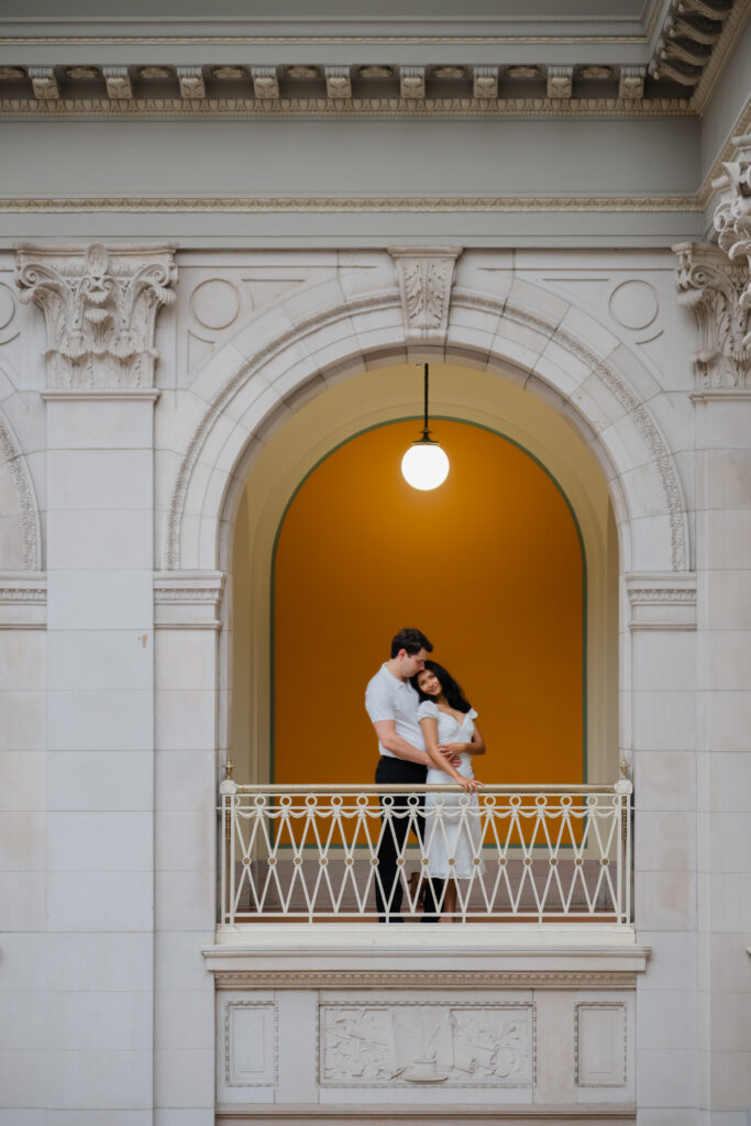 A couple poses for photos before their Hartford City Hall elopement