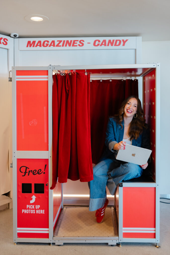 Carla Giorgio, a Marketing Consultant, works on her laptop in the Photo Booth at the iconic TWA Hotel in NYC during her on location branding session.