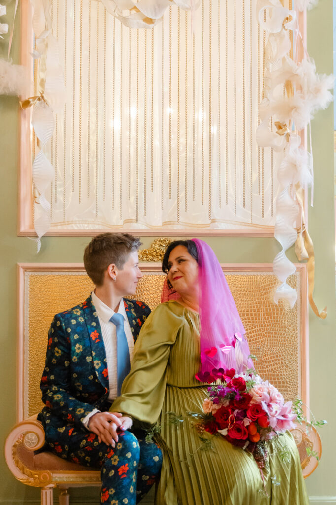 Two brides pose for photos at Hartford Flavor Cocktail Parlour in Hartford CT
