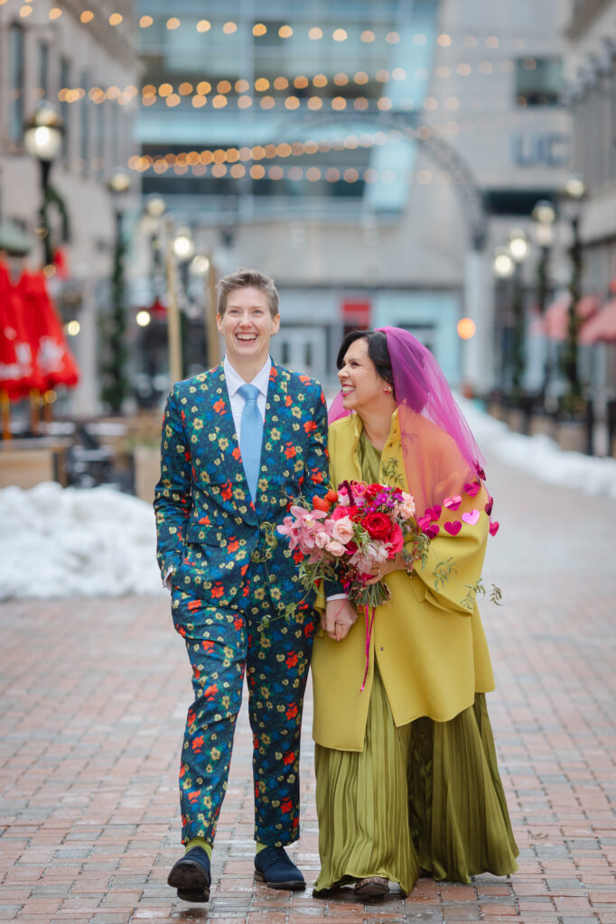 Two brides at their colorful Hartford wedding on Pratt Street in Hartford CT