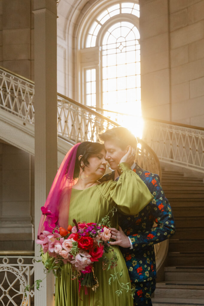 Gorgeous winter light at an LGBTQ colorful Hartford City Hall elopement
