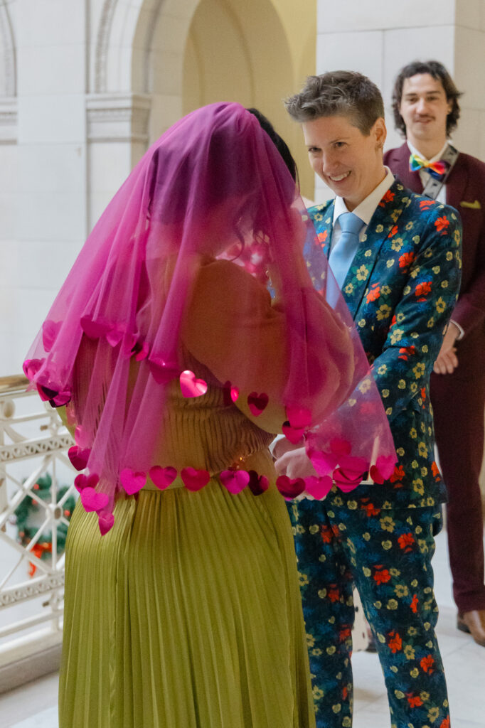 A queer bride cries during her colorful Hartford City Hall Elopement