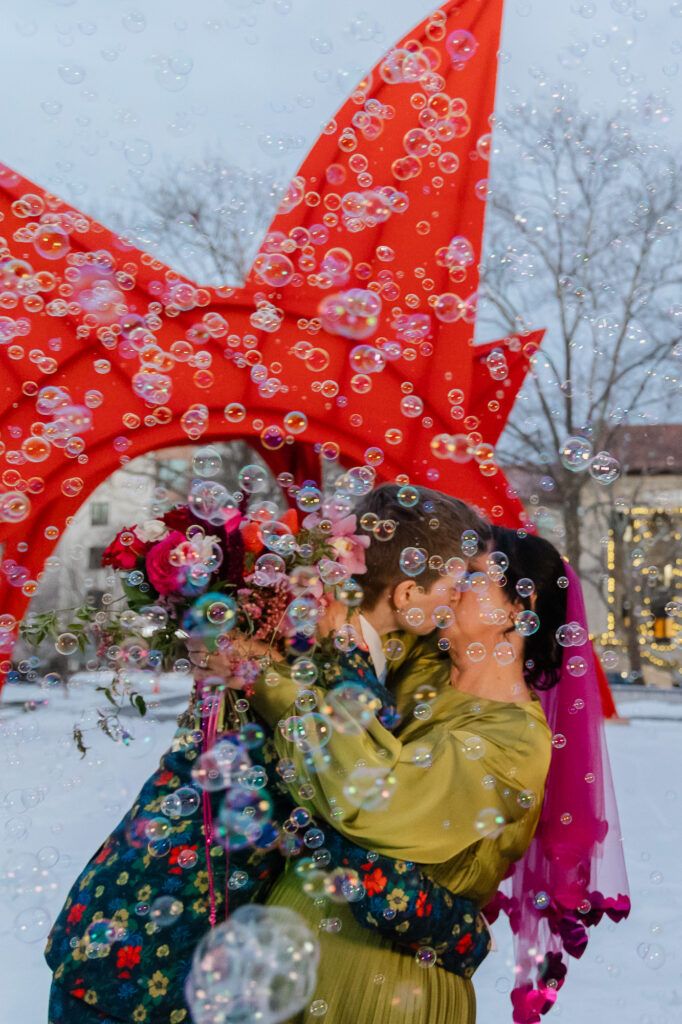 Two brides kiss in bubbles at their lgbtq hartford city hall elopement