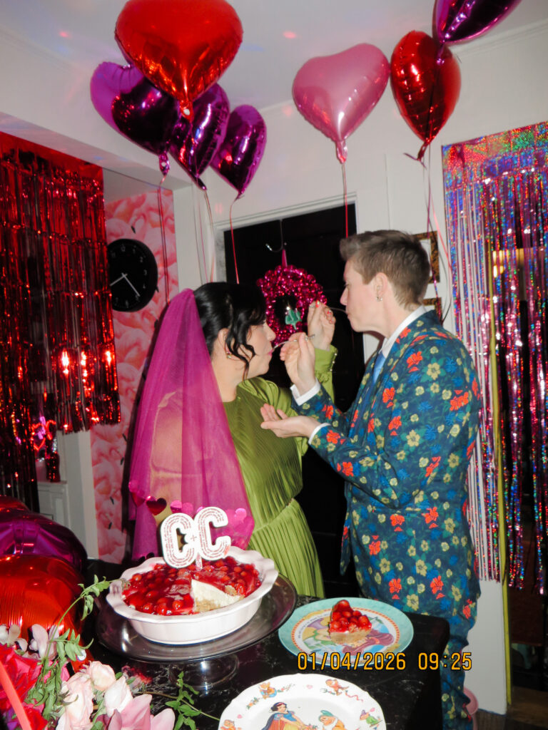 Two brides have their wedding cheesecake in their colorful Hartford kitchen home